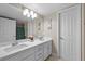 Bathroom featuring double sink vanity with a large mirror at 262 Big Horn Dr, Boulder City, NV 89005