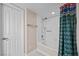 Bright bathroom featuring a tub with white tile surround at 262 Big Horn Dr, Boulder City, NV 89005