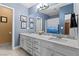 Bathroom featuring modern fixtures, a spacious vanity with double sinks, and stylish blue accents at 262 Big Horn Dr, Boulder City, NV 89005