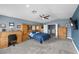 A spacious bedroom with built in wooden furniture, blue walls and carpeted floor at 262 Big Horn Dr, Boulder City, NV 89005