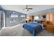 Spacious bedroom features a ceiling fan, carpeted floor, and built in wooden storage at 262 Big Horn Dr, Boulder City, NV 89005