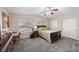 Comfortable bedroom with large windows, ceiling fan, and a spacious closet at 262 Big Horn Dr, Boulder City, NV 89005