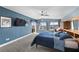 Spacious primary bedroom with large windows, ceiling fan, and built-in wooden storage at 262 Big Horn Dr, Boulder City, NV 89005