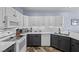 Modern kitchen with white cabinets, stainless appliances, and stylish backsplash at 262 Big Horn Dr, Boulder City, NV 89005