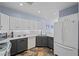 Beautiful kitchen featuring white cabinets, stainless appliances, and stone flooring at 262 Big Horn Dr, Boulder City, NV 89005
