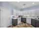 Contemporary kitchen with white cabinetry, stainless steel appliances, and ample counter space at 262 Big Horn Dr, Boulder City, NV 89005