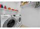 Laundry room featuring a modern side-by-side washer and dryer and built in shelving at 262 Big Horn Dr, Boulder City, NV 89005