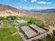 Image of a park including a playground, basketball court, and tennis court near desert mountains and a lake at 262 Big Horn Dr, Boulder City, NV 89005