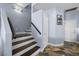 Interior view of staircase with wooden steps, neutral walls, and white trim at 262 Big Horn Dr, Boulder City, NV 89005