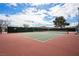 Outdoor tennis court with net, fencing, and seating at 262 Big Horn Dr, Boulder City, NV 89005