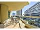 Spacious balcony with outdoor seating offers views of the surrounding buildings and clear skies at 2747 Paradise Rd # 801, Las Vegas, NV 89109