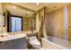 A full bath includes a single sink vanity, toilet, and shower/tub combination at 2747 Paradise Rd # 801, Las Vegas, NV 89109