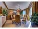 Dining room with decorative wooden trim, hardwood flooring, and luxurious upholstered chairs at 2747 Paradise Rd # 801, Las Vegas, NV 89109