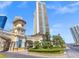 Grand entrance with a clock tower, lush landscaping, and access to the building at 2747 Paradise Rd # 801, Las Vegas, NV 89109