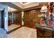 Elegant hallway with double wood doors, wall mirrors, stone floors and classic decor at 2747 Paradise Rd # 801, Las Vegas, NV 89109