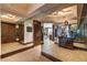 Hallway featuring mirrored walls and an elegant entryway with paneled wood doors at 2747 Paradise Rd # 801, Las Vegas, NV 89109