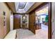 Elegant hallway featuring beautiful wood doors, stone floors, seating and elegant decor at 2747 Paradise Rd # 801, Las Vegas, NV 89109