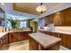 Beautiful kitchen with wood cabinets, an island with a marble top, and stainless appliances at 2747 Paradise Rd # 801, Las Vegas, NV 89109