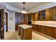 Kitchen includes wood cabinets, tiled floors, and a marble-topped island with a drink cooler at 2747 Paradise Rd # 801, Las Vegas, NV 89109