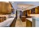 The kitchen area features wooden cabinets, stone floors, and marble countertops at 2747 Paradise Rd # 801, Las Vegas, NV 89109