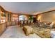 Cozy living room features custom cabinetry with built-in bar, comfortable seating and stone floors at 2747 Paradise Rd # 801, Las Vegas, NV 89109