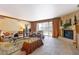 Comfortable living room with a cozy fireplace and balcony access provides an inviting space for relaxation and enjoyment at 2747 Paradise Rd # 801, Las Vegas, NV 89109