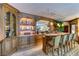 Living room showcasing custom built-in wet bar, shelving and bar stools at 2747 Paradise Rd # 801, Las Vegas, NV 89109