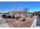 Backyard area with rock landscaping and a mature tree at 3024 Saint George St # G, North Las Vegas, NV 89030