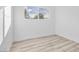 Bright bedroom featuring natural light, neutral paint, and modern flooring at 3411 E Diana Dr, North Las Vegas, NV 89030