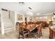 Open dining room with elegant chandelier and wood-style flooring at 3427 Meridale Dr, Las Vegas, NV 89117