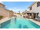 Beautiful backyard pool with a spa and covered patio area for outdoor dining and relaxation at 3427 Meridale Dr, Las Vegas, NV 89117