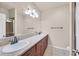 Bathroom with double sinks, granite countertop, and wooden cabinets at 3550 Bay Sands Dr # 2087, Laughlin, NV 89029