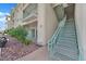 Exterior stairs lead to upper units, with well-maintained landscaping and desert rock ground cover at 3550 Bay Sands Dr # 2087, Laughlin, NV 89029