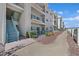 Building exterior features outdoor stairwell and walkway surrounded by green landscaping at 3550 Bay Sands Dr # 2087, Laughlin, NV 89029