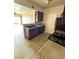 Kitchen features stainless steel appliances, granite countertops, tile floors and breakfast bar at 3550 Bay Sands Dr # 2087, Laughlin, NV 89029