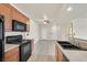 Well-lit kitchen with black appliances and wooden cabinets at 3550 Bay Sands Dr # 2087, Laughlin, NV 89029