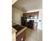 Cozy kitchen featuring granite counters, tile floors, wooden cabinets and modern, black appliances at 3550 Bay Sands Dr # 2087, Laughlin, NV 89029