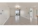 Open living area features neutral walls, tiled floors, and sliding glass doors to a balcony at 3550 Bay Sands Dr # 2087, Laughlin, NV 89029