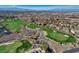 Beautiful aerial view of the golf course, community, and the city skyline in the background at 431 Tranquil Peak Ct, Henderson, NV 89012