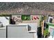 An aerial view of the building showcasing the outdoor patio, rooftop design, and manicured landscaping at 431 Tranquil Peak Ct, Henderson, NV 89012