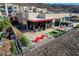 Inviting back patio with comfortable seating, modern decor, and a cozy fire pit perfect for outdoor relaxation at 431 Tranquil Peak Ct, Henderson, NV 89012