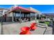Backyard patio with modern furniture, potted plants, and a fire pit at 431 Tranquil Peak Ct, Henderson, NV 89012