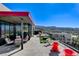 Backyard patio with modern furniture, potted plants, and a skyline view of the city at 431 Tranquil Peak Ct, Henderson, NV 89012
