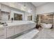 Spa-like bathroom with double vanity, soaking tub, and modern fixtures at 431 Tranquil Peak Ct, Henderson, NV 89012