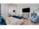 Bright bedroom with light-colored furniture, a flat-screen TV, and cozy decor at 431 Tranquil Peak Ct, Henderson, NV 89012