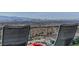 Chairs on the patio offering incredible views of the city skyline and surrounding landscape at 431 Tranquil Peak Ct, Henderson, NV 89012