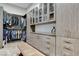 Well-organized closet with ample storage, custom cabinets, and a stylish bench at 431 Tranquil Peak Ct, Henderson, NV 89012