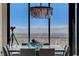 A dining room with modern chandelier and views of city skyline at 431 Tranquil Peak Ct, Henderson, NV 89012