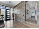 Grand entryway featuring a decorative statue, wood flooring, and abundant natural light at 431 Tranquil Peak Ct, Henderson, NV 89012