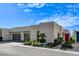Contemporary home with desert landscaping, a modern garage door, and sleek architectural details at 431 Tranquil Peak Ct, Henderson, NV 89012